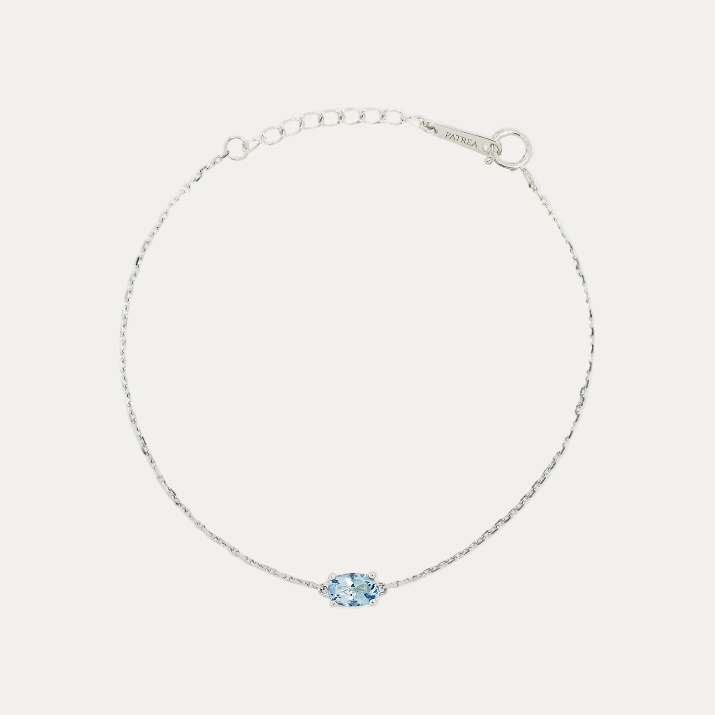 18k White Gold bracelet with an ocean blue aquamarine on a light gray background