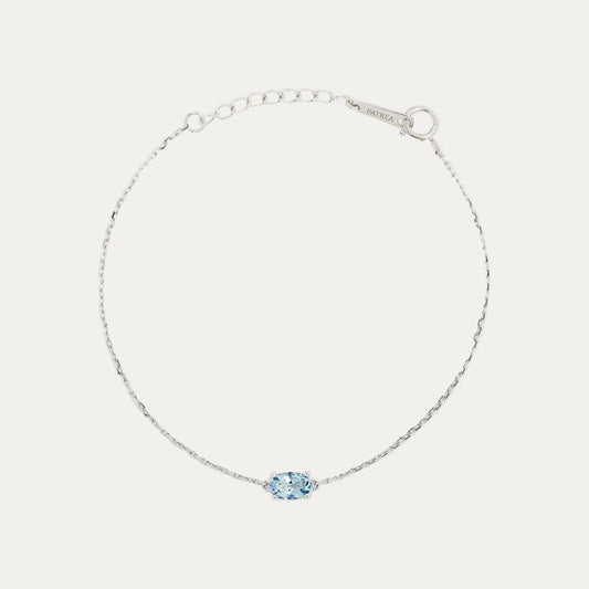 18k White Gold bracelet with an ocean blue aquamarine on a light gray background