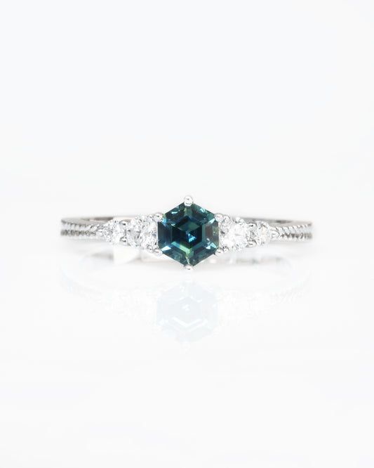18k white gold blue green teal sapphire ring on a white background