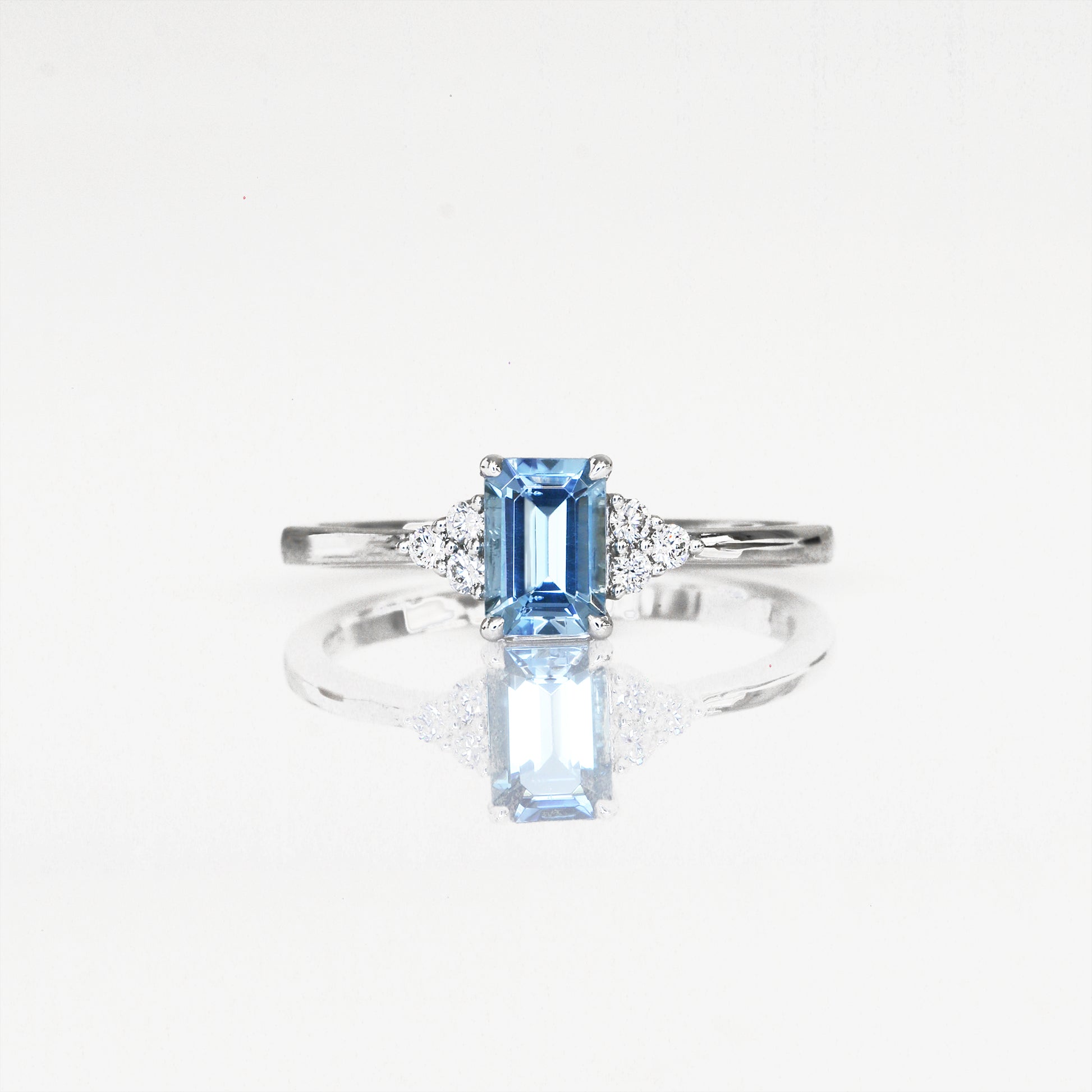 Diamond Ring with a santa maria aquamarine diamond ring on a white background
