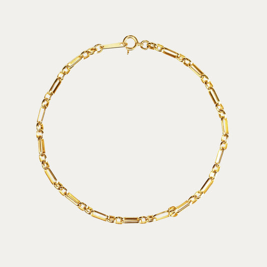 Gold chain bracelet on a white background