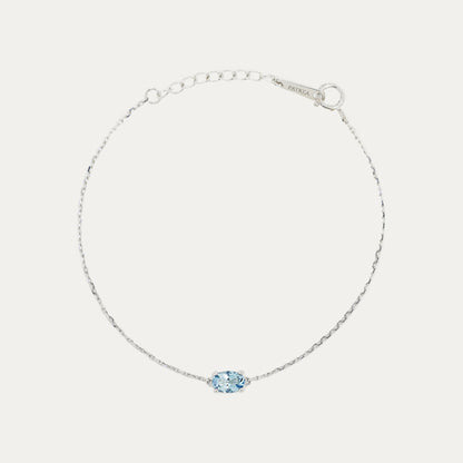18k White Gold bracelet with an ocean blue aquamarine on a light gray background