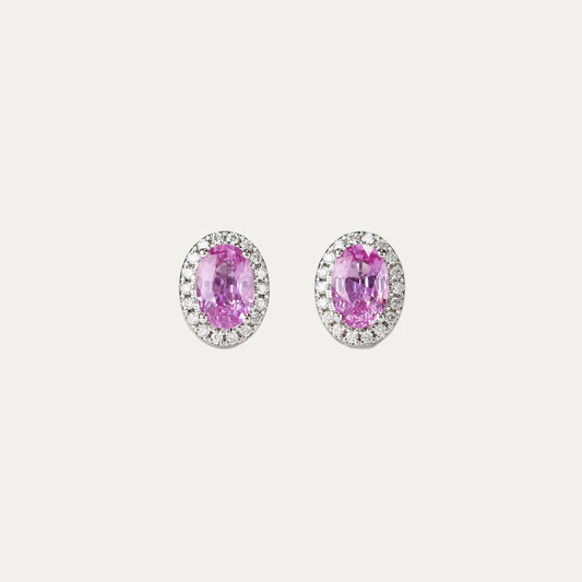 Pair of oval-shaped pink sapphire halo diamond earrings on a gray background