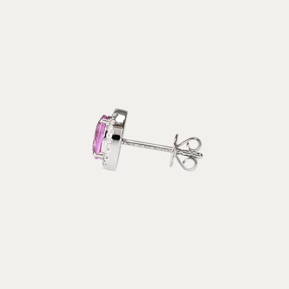Pair of oval-shaped pink sapphire halo diamond earrings on a gray background