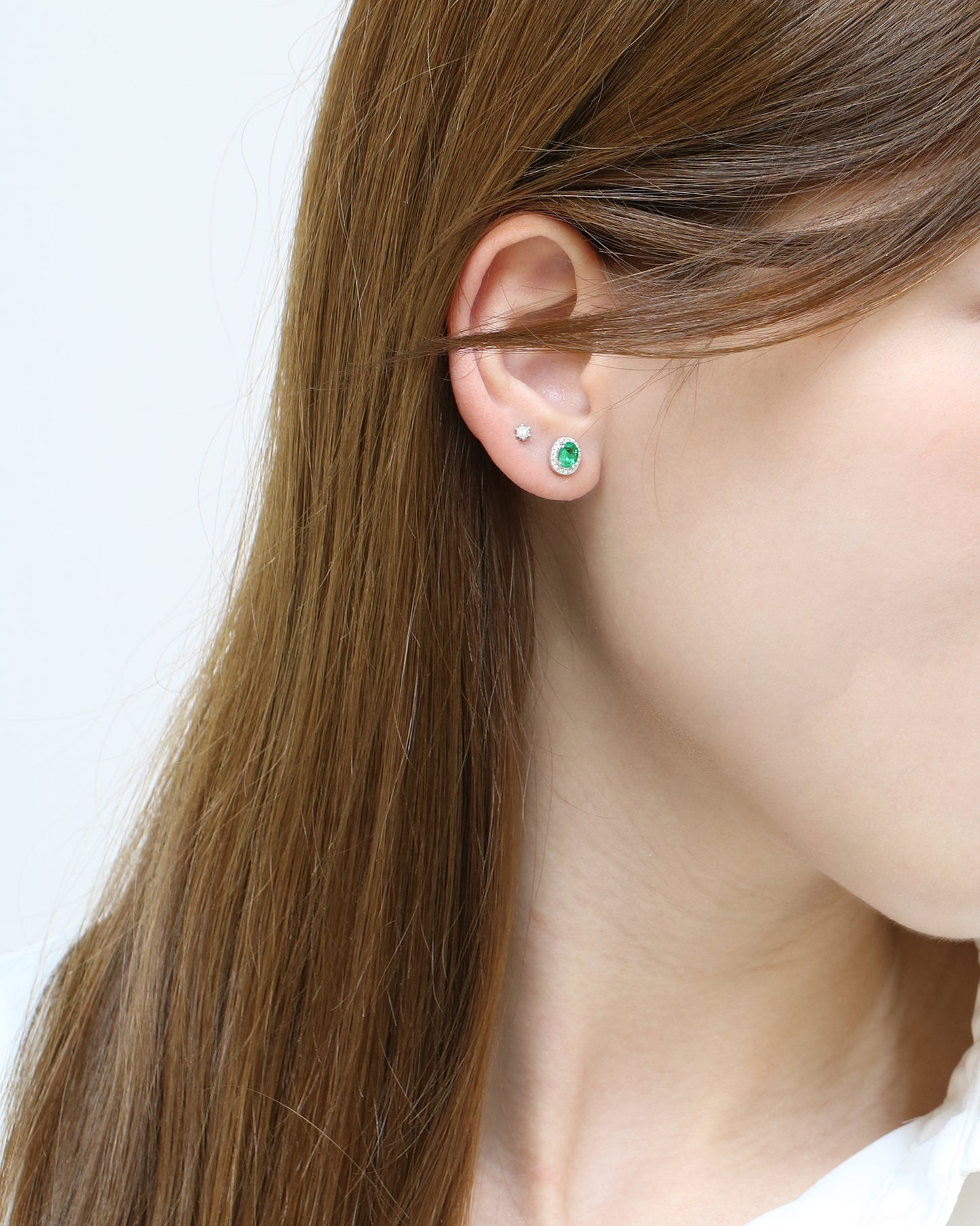 18k White Gold Oval-shaped Emerald Halo Diamond Earrings