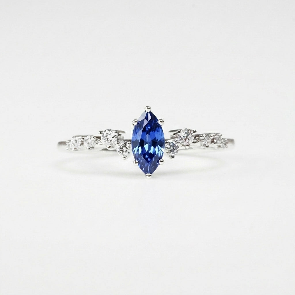 18k White Gold Marquise Sapphire Scattered Diamond Ring