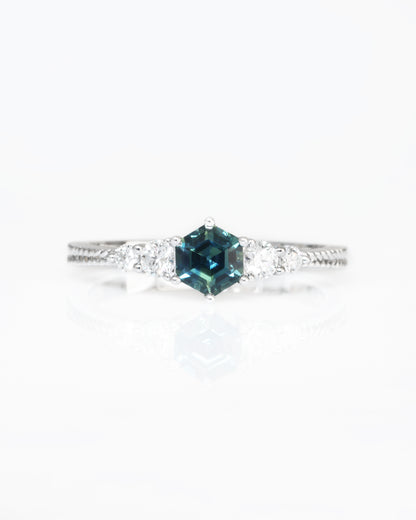 18k white gold blue green teal sapphire ring on a white background